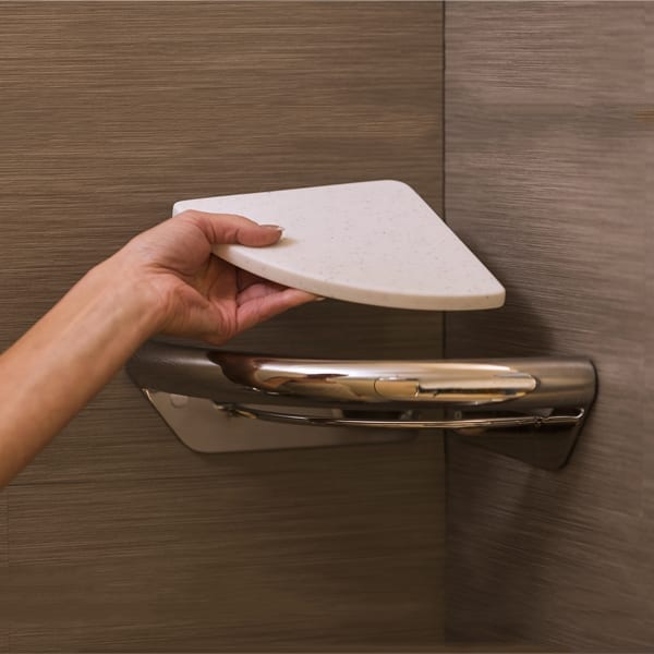 Woman showing how easy it is to remove and install the bathroom shelves